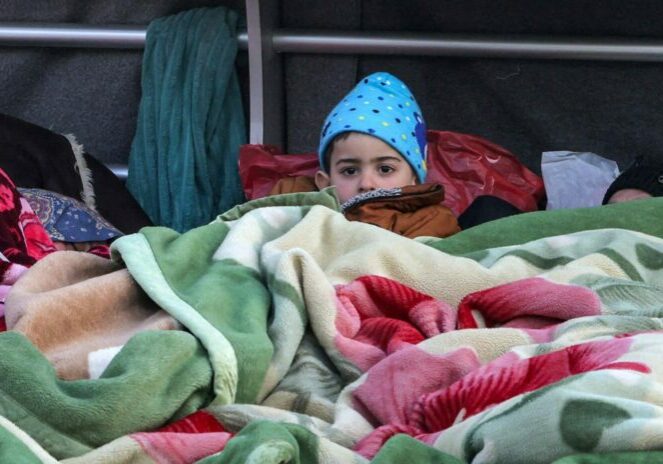 A boy looks on while lying under a blanket alongside family belongings in a makeshift encampment along the waterfront in Beirut on March 10, 2026, as civilians who fled the city's southern suburbs due to Israeli bombardment remain displaced. Lebanese authorities said on March 9 that Israel's attacks since March 2 have killed at least 486 people and wounded at least 1,313, with more than 660,000 registered as displaced and 120,000 sleeping at official shelters. Lebanon was drawn into the Middle East war when Iran-backed Hezbollah attacked Israel, in response to the killing of the Iranian supreme leader in US-Israeli strikes on February 28.
Anwar AMRO / AFP
