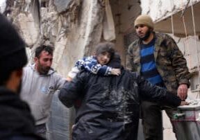 Residents retrieve a small child from the rubble of a collapsed building following an earthquake in the town of Jandaris, in the countryside of Syria's northwestern city of Afrin in the rebel-held part of Aleppo province, on February 6, 2023. Hundreds have been reportedly killed in north Syria after a 7.8-magnitude earthquake that originated in Turkey and was felt across neighbouring countries.
Rami al SAYED / AFP